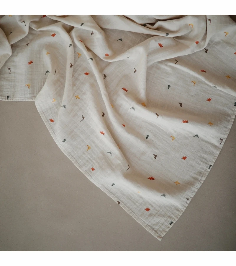 Mushie Organic Cotton Muslin Swaddle Blanket - Dinosaurs 2 Mushie Organic Cotton Muslin Swaddle Blanket - Dinosaurs - Image 2