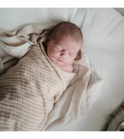 Mushie Organic Cotton Muslin Swaddle Blanket - Natural Stripe 5 Mushie Organic Cotton Muslin Swaddle Blanket - Natural Stripe -Britax || Little Unicorn || Graco Shop mushie organic cotton muslin swaddle blanket natural stripe 9